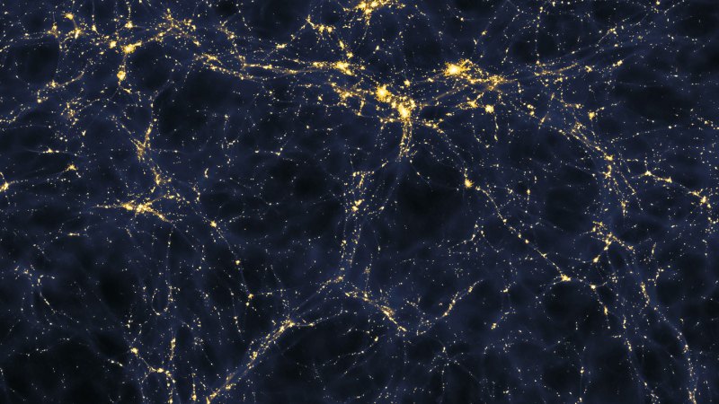 Bright points are scattered in a weblike pattern over a dark background in a computer simulation of the cosmic web.