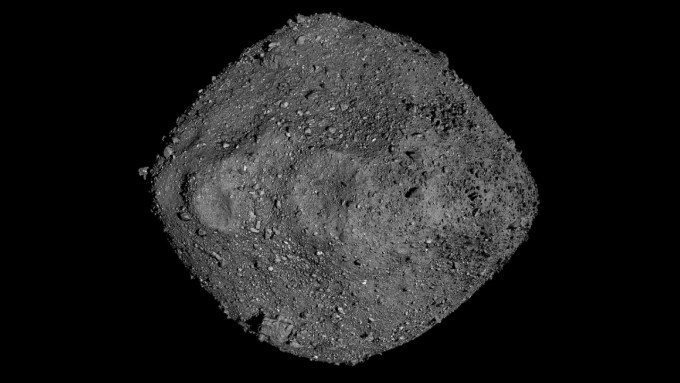 The asteroid Bennu appears as gray, rocky object on a black background